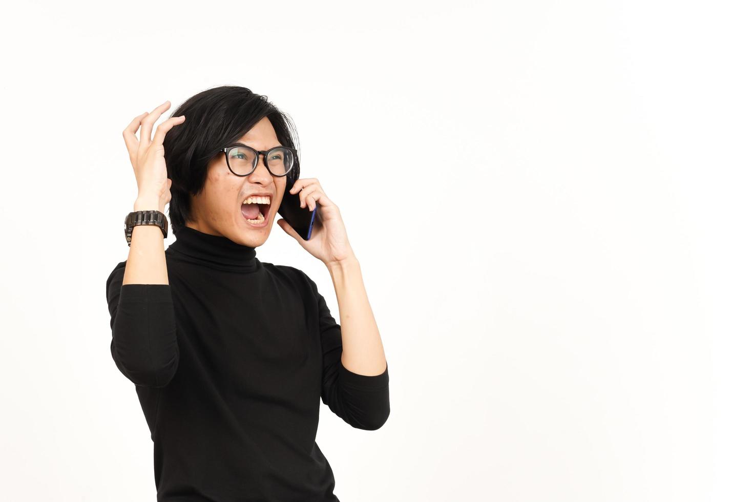 Make a Phone Call Using smartphone with Angry Face Of Handsome Asian Man Isolated On White photo