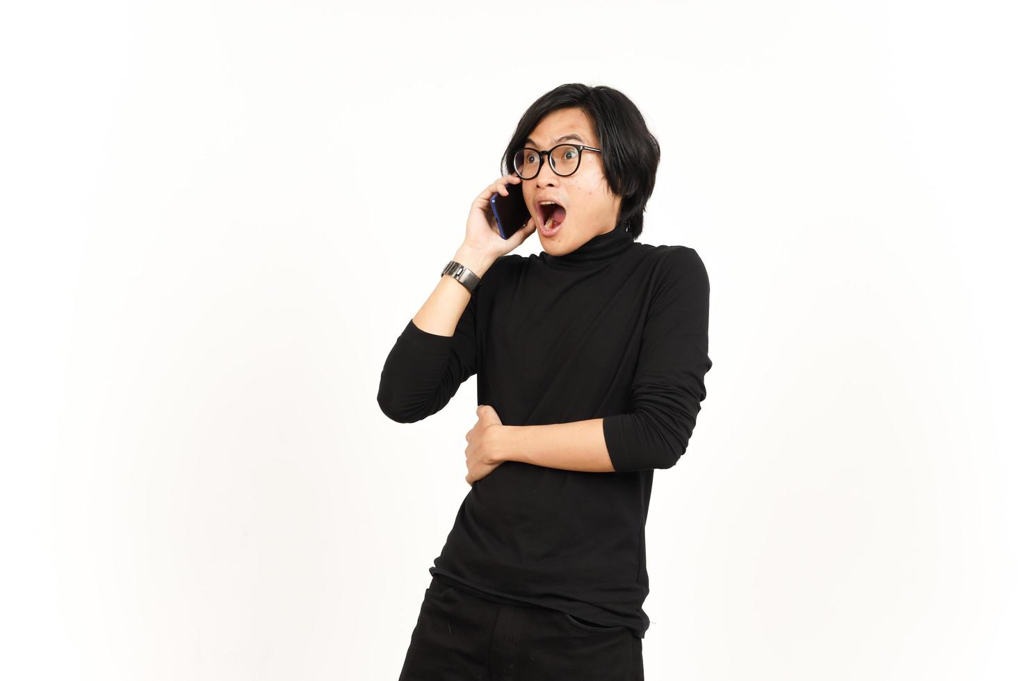 Make a Phone Call Using smartphone with shocked face Of Handsome Asian Man Isolated On White photo