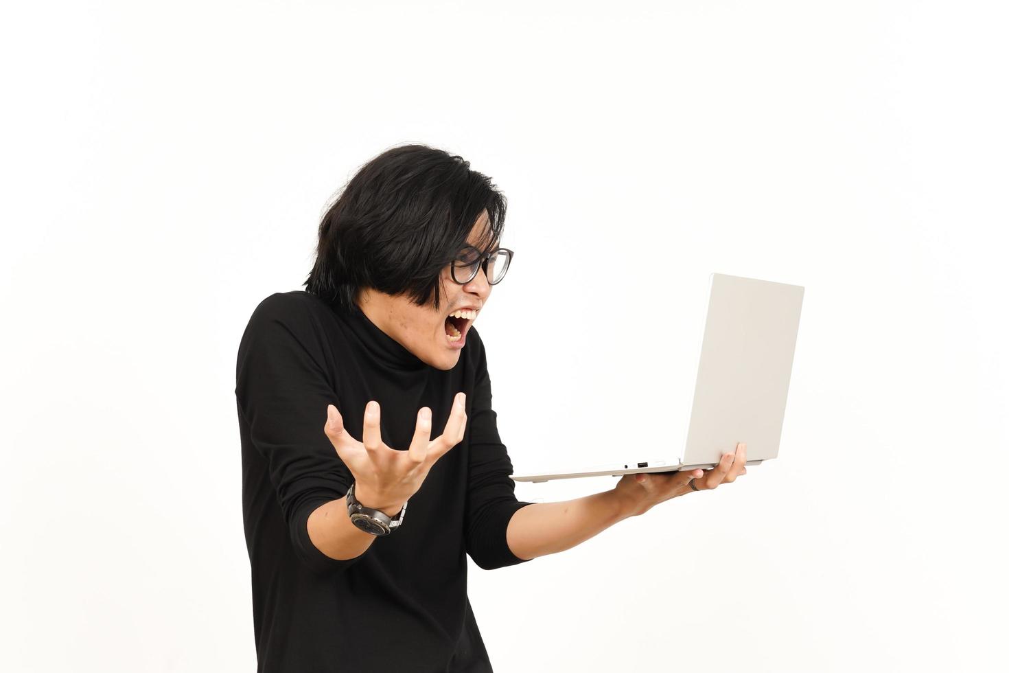 Shock and Angry While Using Laptop Of Handsome Asian Man Isolated On White Background photo
