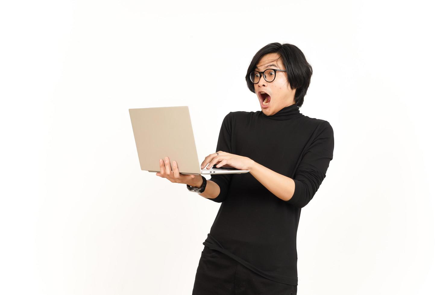 Shock and Angry While Using Laptop Of Handsome Asian Man Isolated On White Background photo