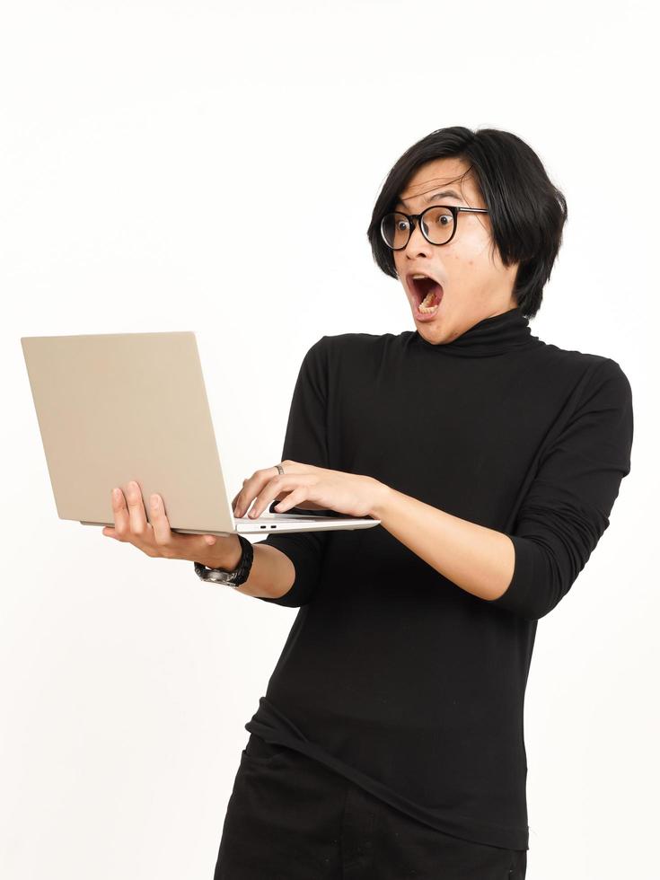 Shock and Angry While Using Laptop Of Handsome Asian Man Isolated On White Background photo