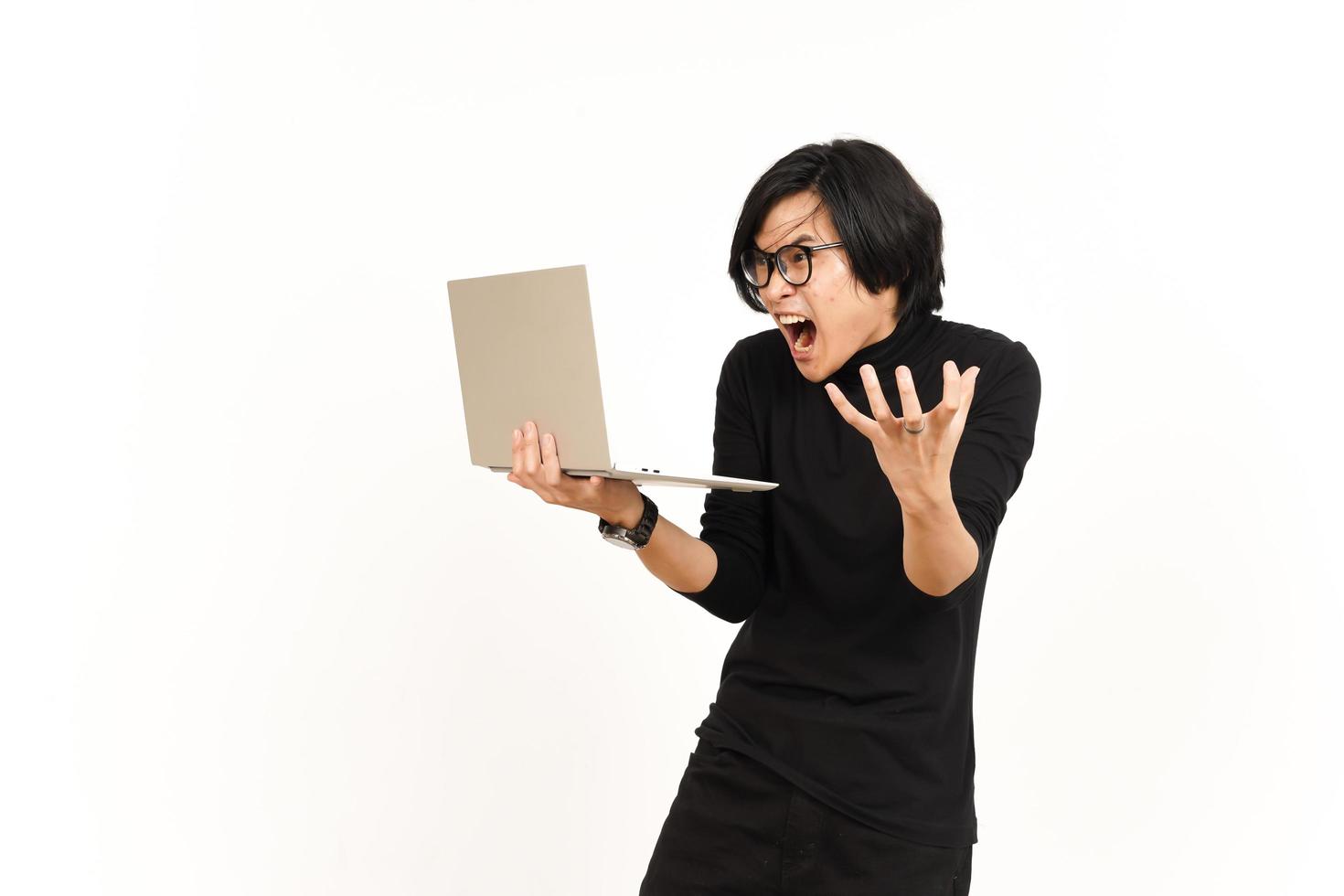 Shock and Angry While Using Laptop Of Handsome Asian Man Isolated On White Background photo