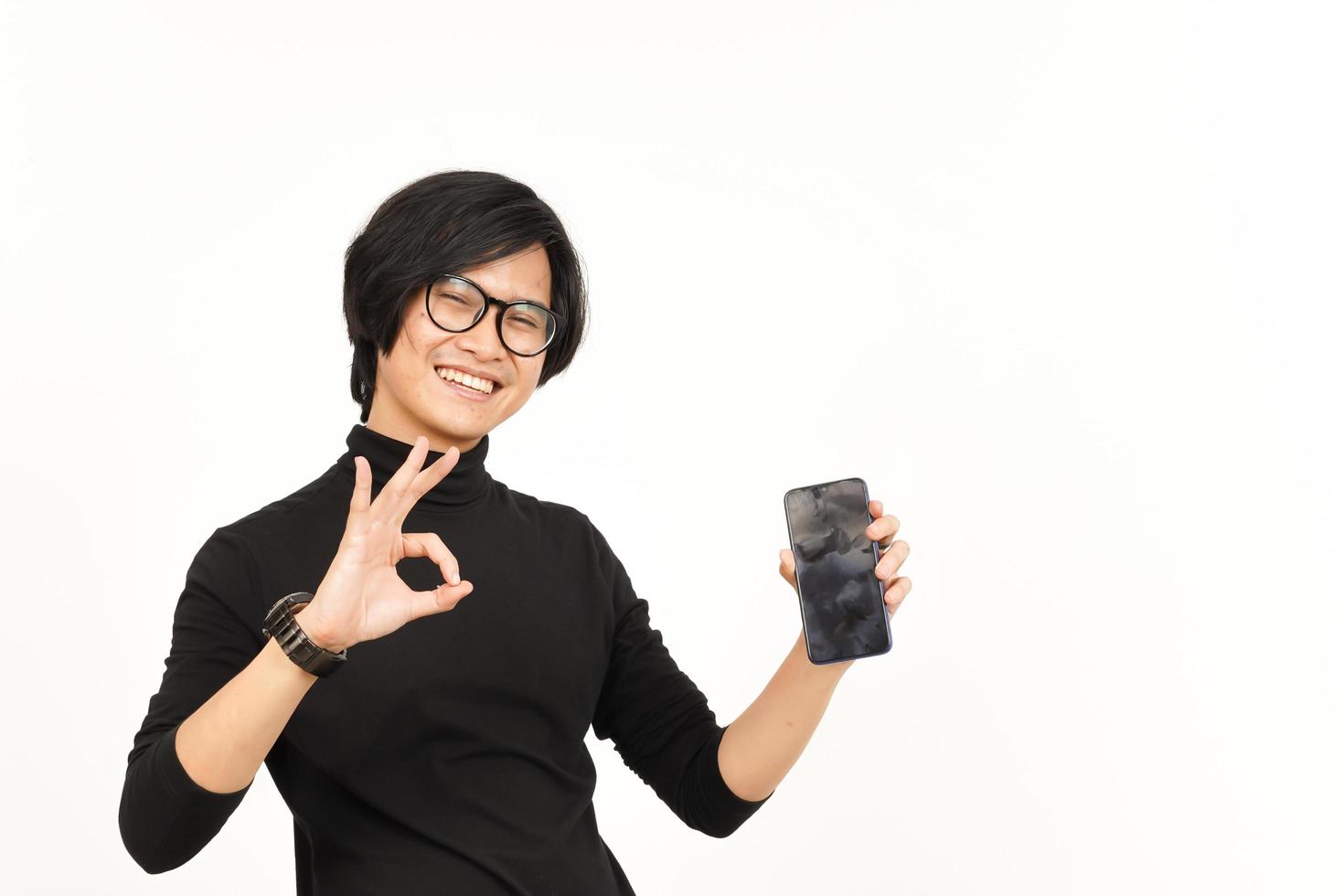 Showing Apps or Ads On Blank Screen Smartphone Of Handsome Asian Man Isolated On White Background photo