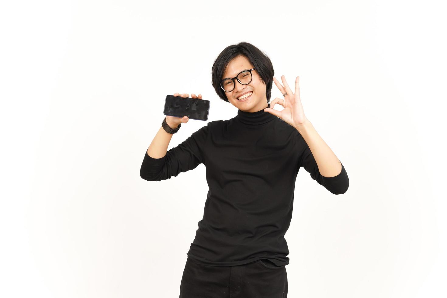 Showing Apps or Ads On Blank Screen Smartphone Of Handsome Asian Man Isolated On White Background photo