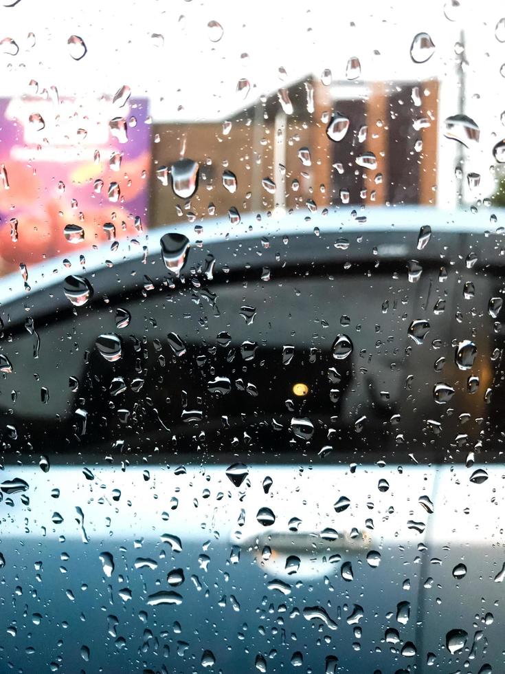 raindrops splashing on the car window photo