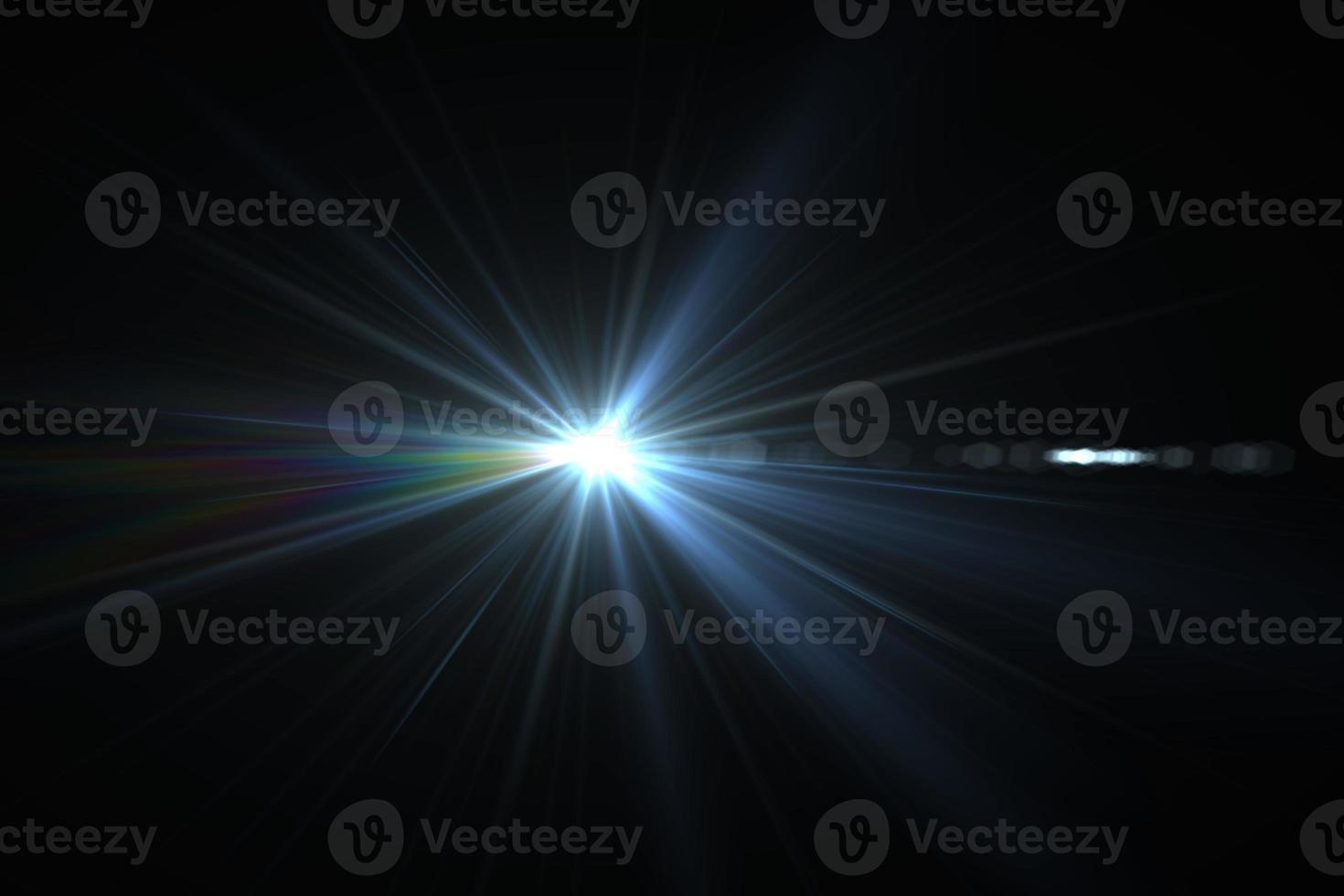Bright beam of a searchlight on a dark background. Light from a lamp in the dark.Flash photo