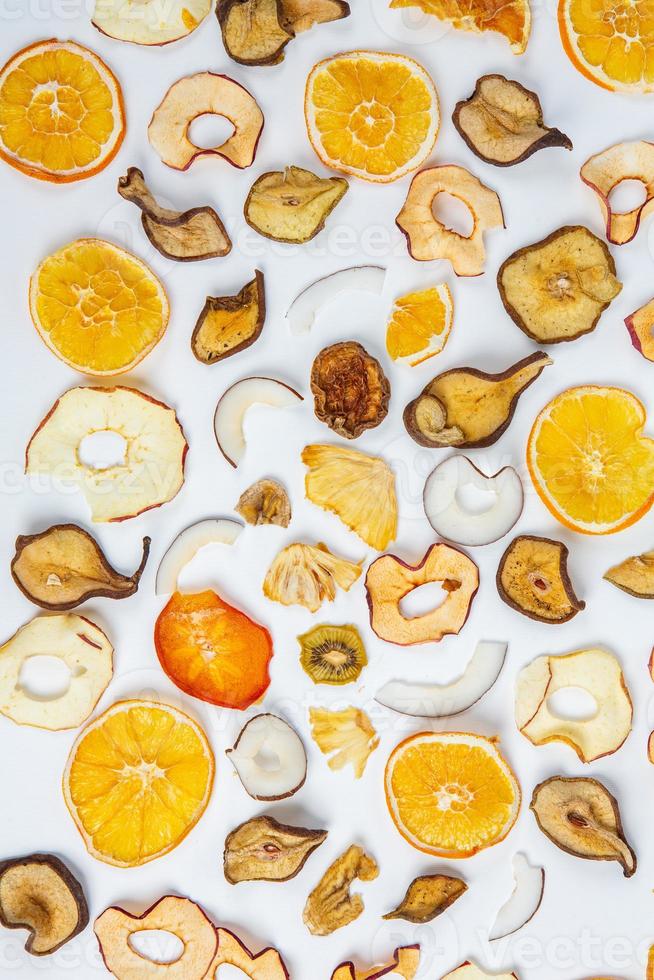 Dried fruits isolated on white background. Healthy eating concept. Top view. Healthy vegetarian food concept. Dried fruit chips. photo