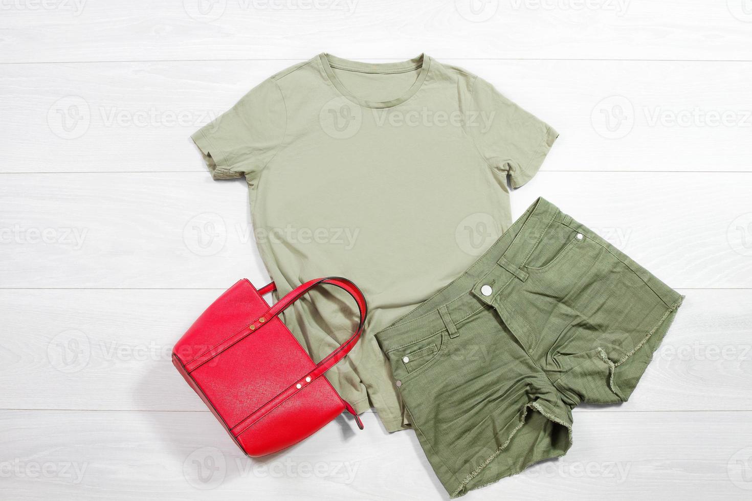 Khaki mint female t shirt mockup flat lay on wooden background. Summer clothing canas. Mint trousers. Top front view t-shirt. Template blank copy space. Summertime season photo