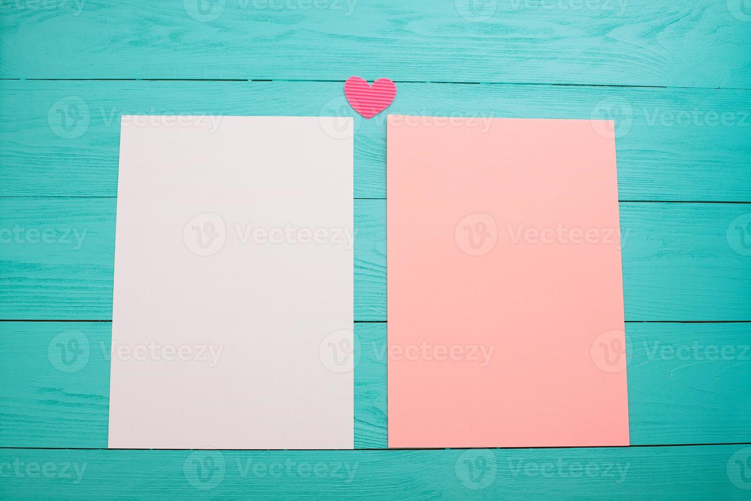 empty colored blank sheets of paper on wooden table close up photo