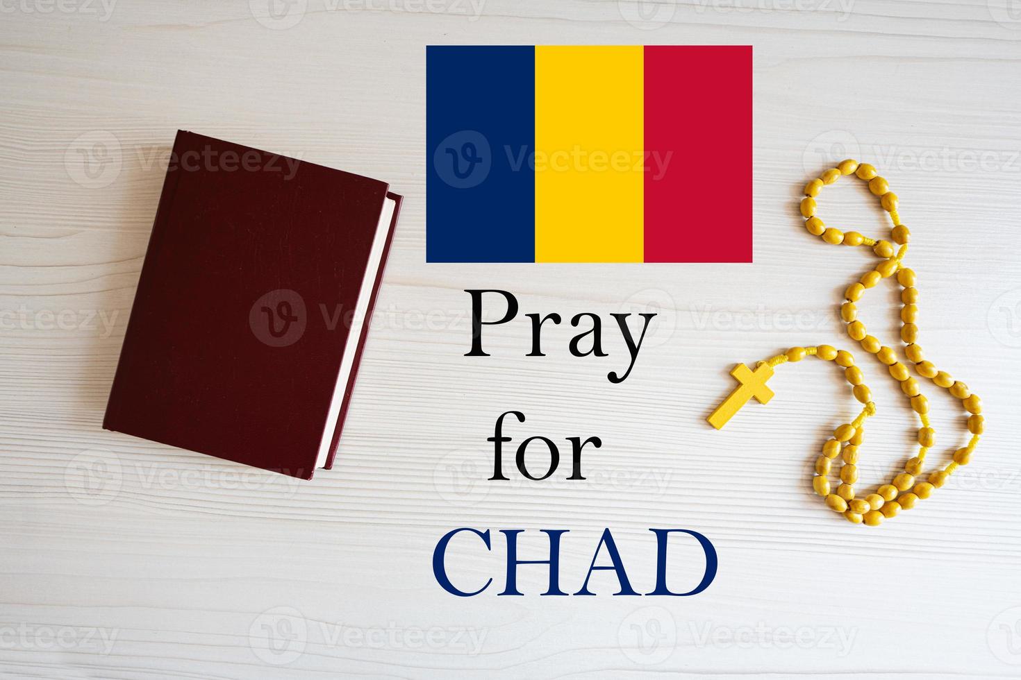 Pray for Chad. Rosary and Holy Bible background. photo