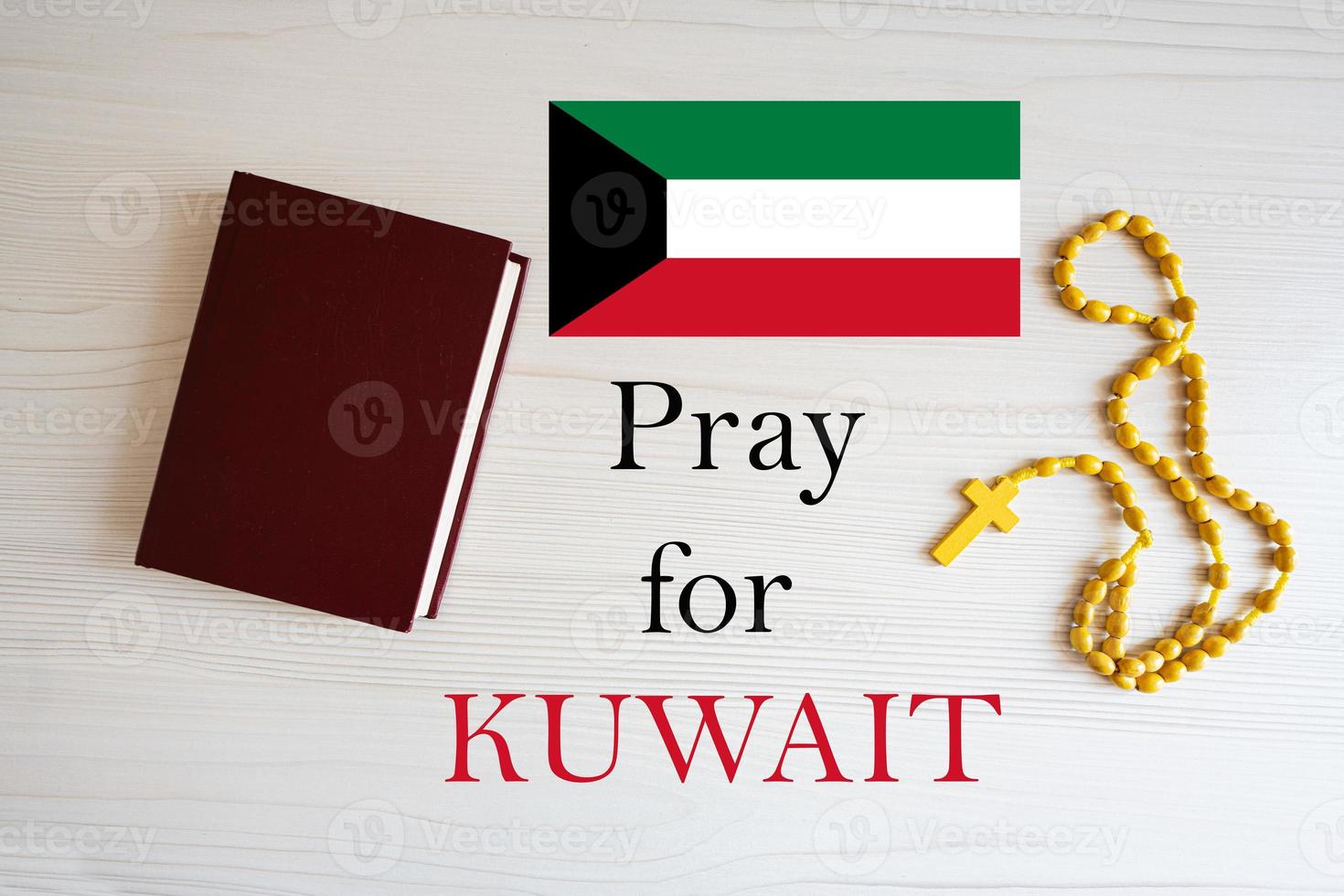 Pray for Kuwait. Rosary and Holy Bible background. photo