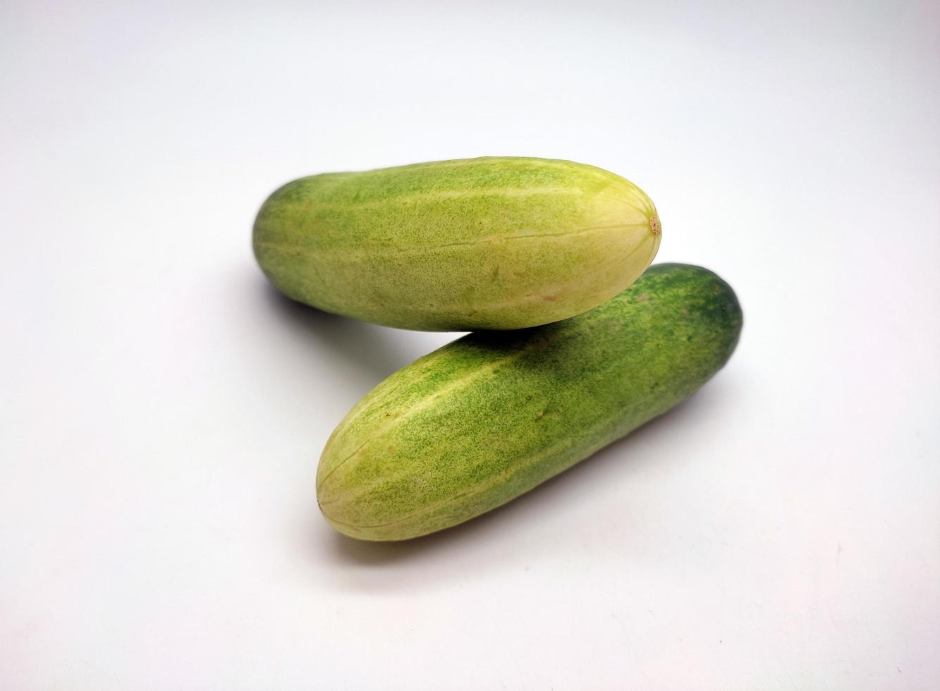 Slices of cucumbers isolated in white background photo
