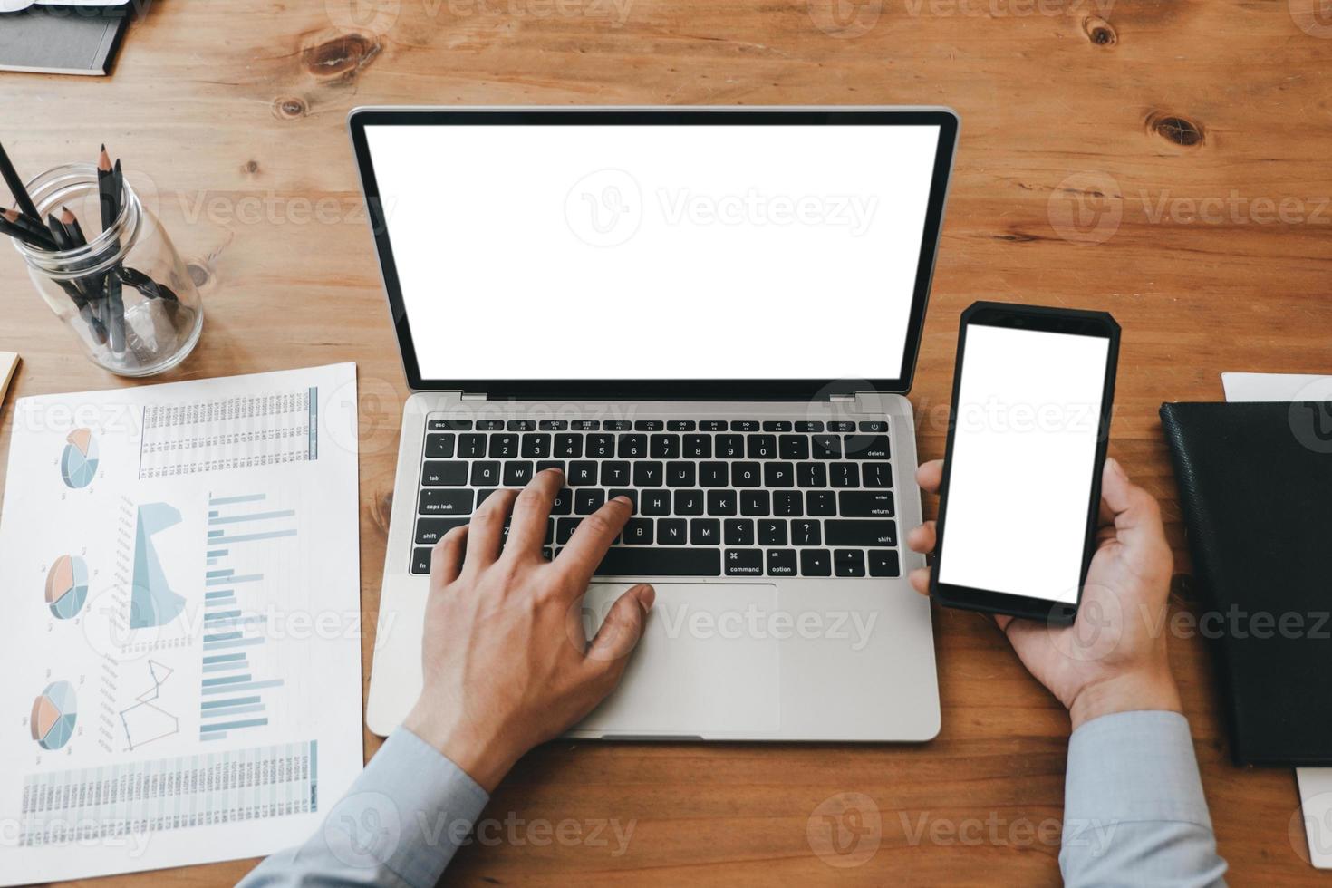 Mockup image of close up business woman working with smartphone laptop and documents in office, mockup concept photo