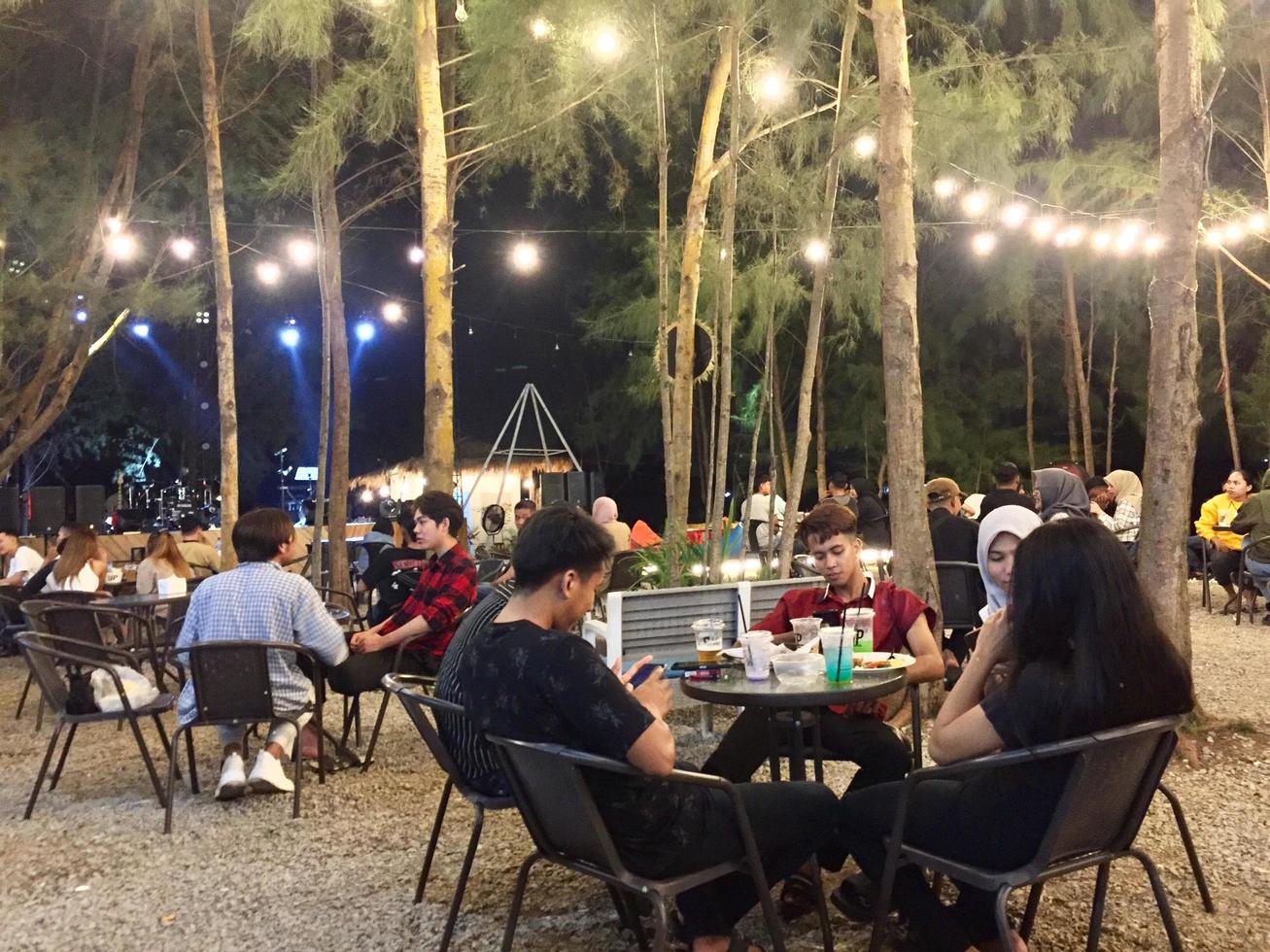 Batam,Indonesia-April 2023, Hanging out at the cafe at night with