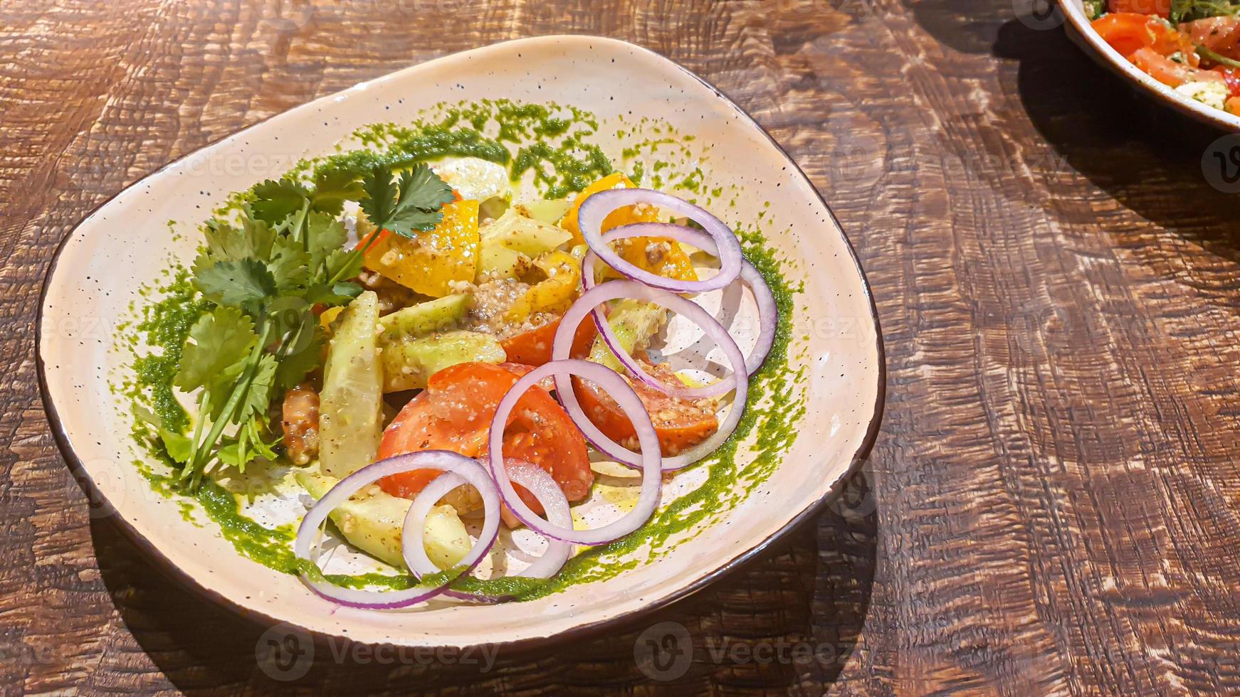 Diet salad of fresh vegetables. Lettuce, poached egg, tomatoes, green onions and chili peppers. Sauce. photo
