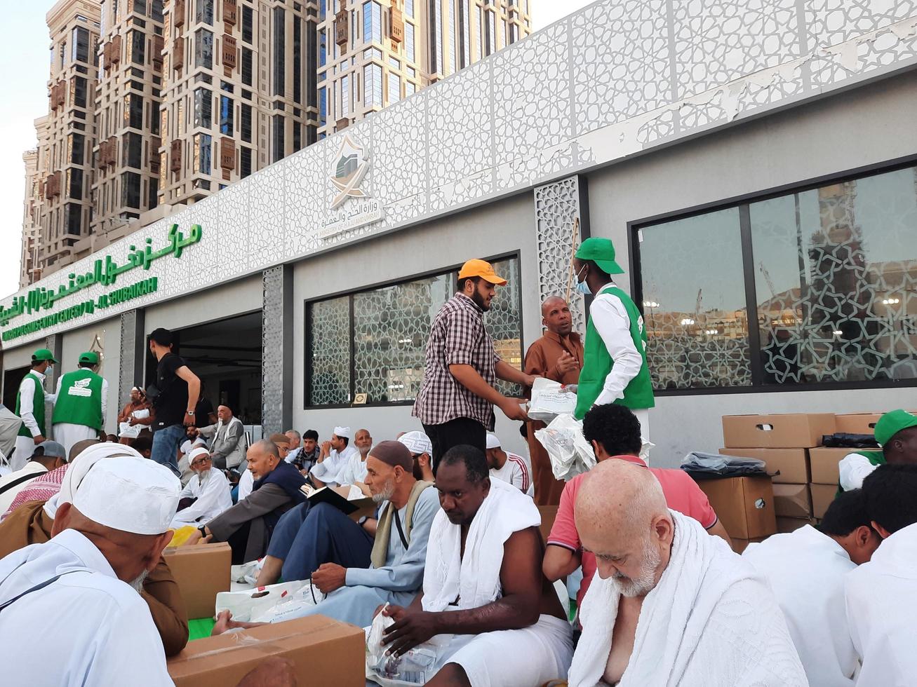 Mecca, Saudi Arabia, April 2023 - Pilgrims from different countries around the world are busy breaking their fast in the courtyard outside Masjid al-Haram. photo