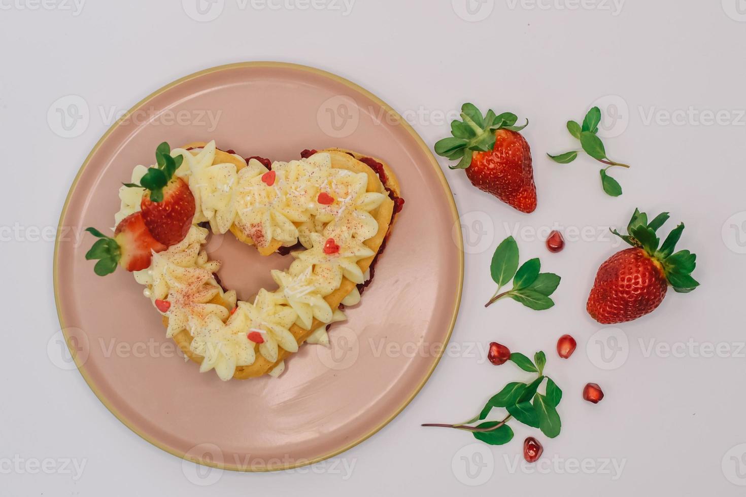 cake with Strawberry and vanilla cream. heart Biscuit photo