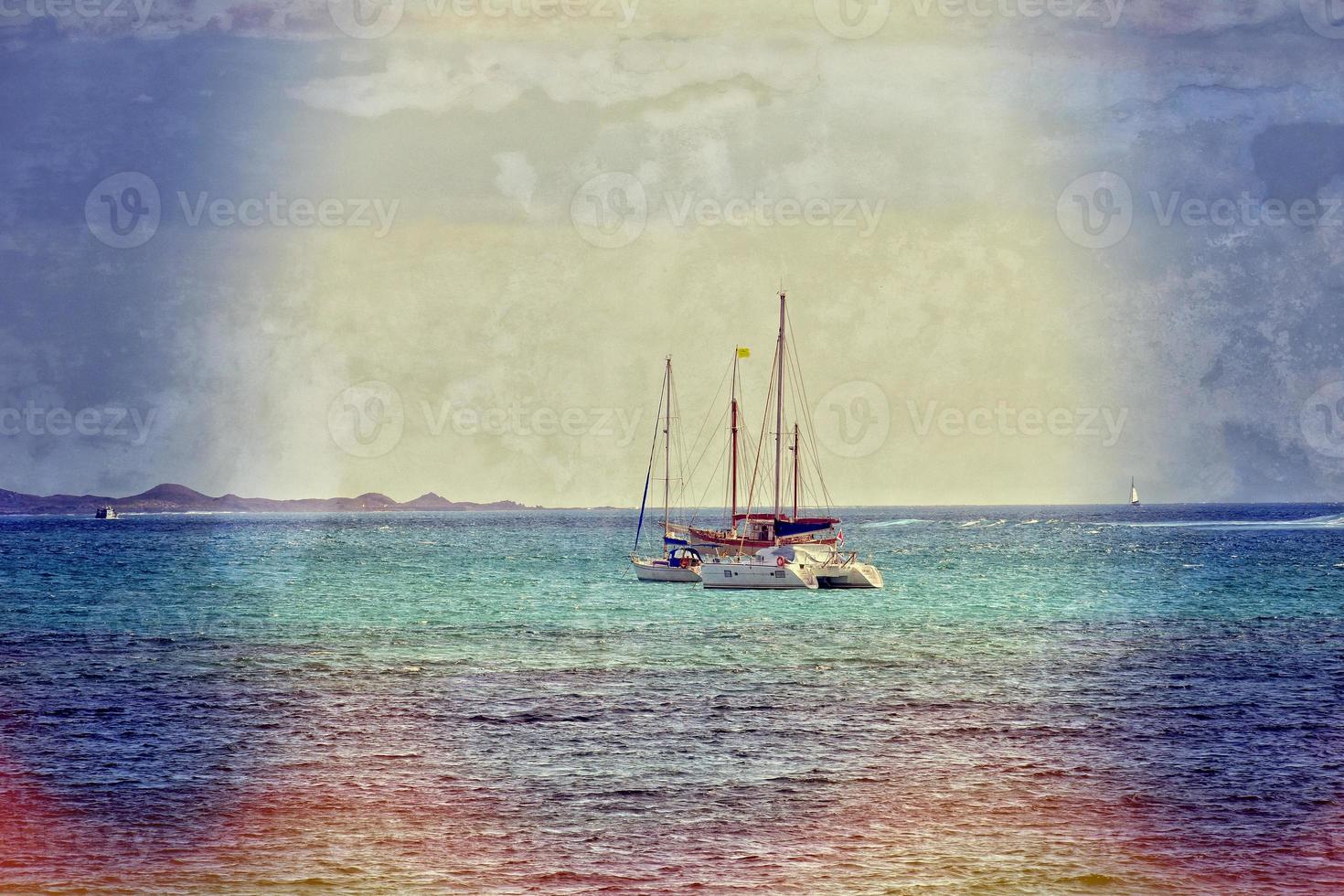 oceanic calm landscape on the Spanish island of Fuerteventura with boats photo