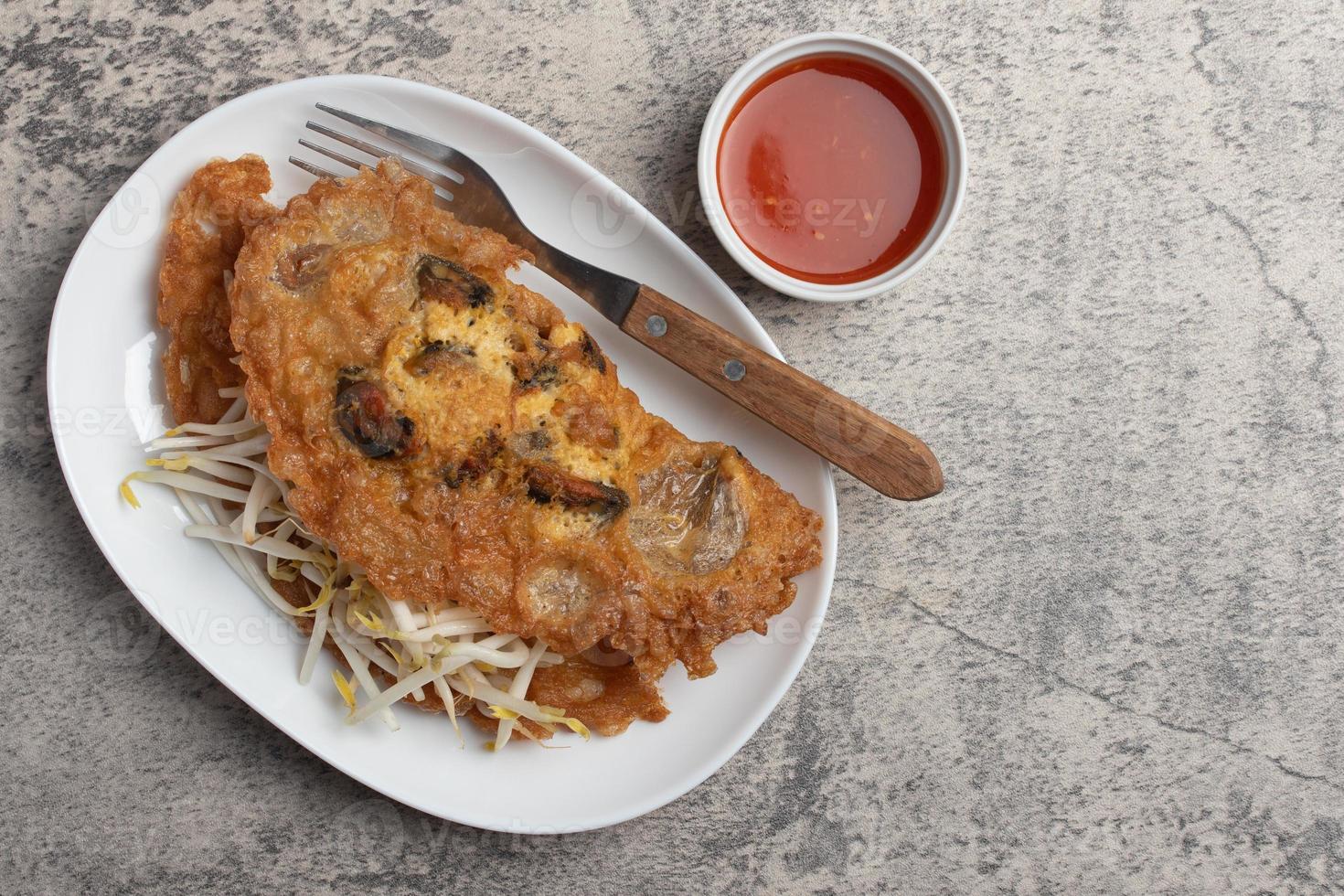 Fried mussels in crispy batter in a white plate photo