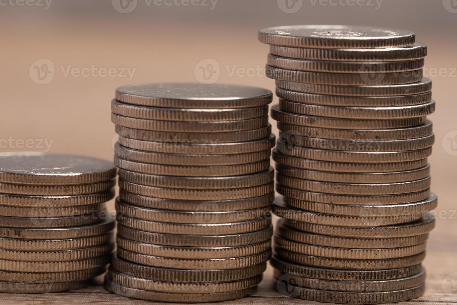 Coins stacked on brown background. Investment finance concept. Copy space. photo