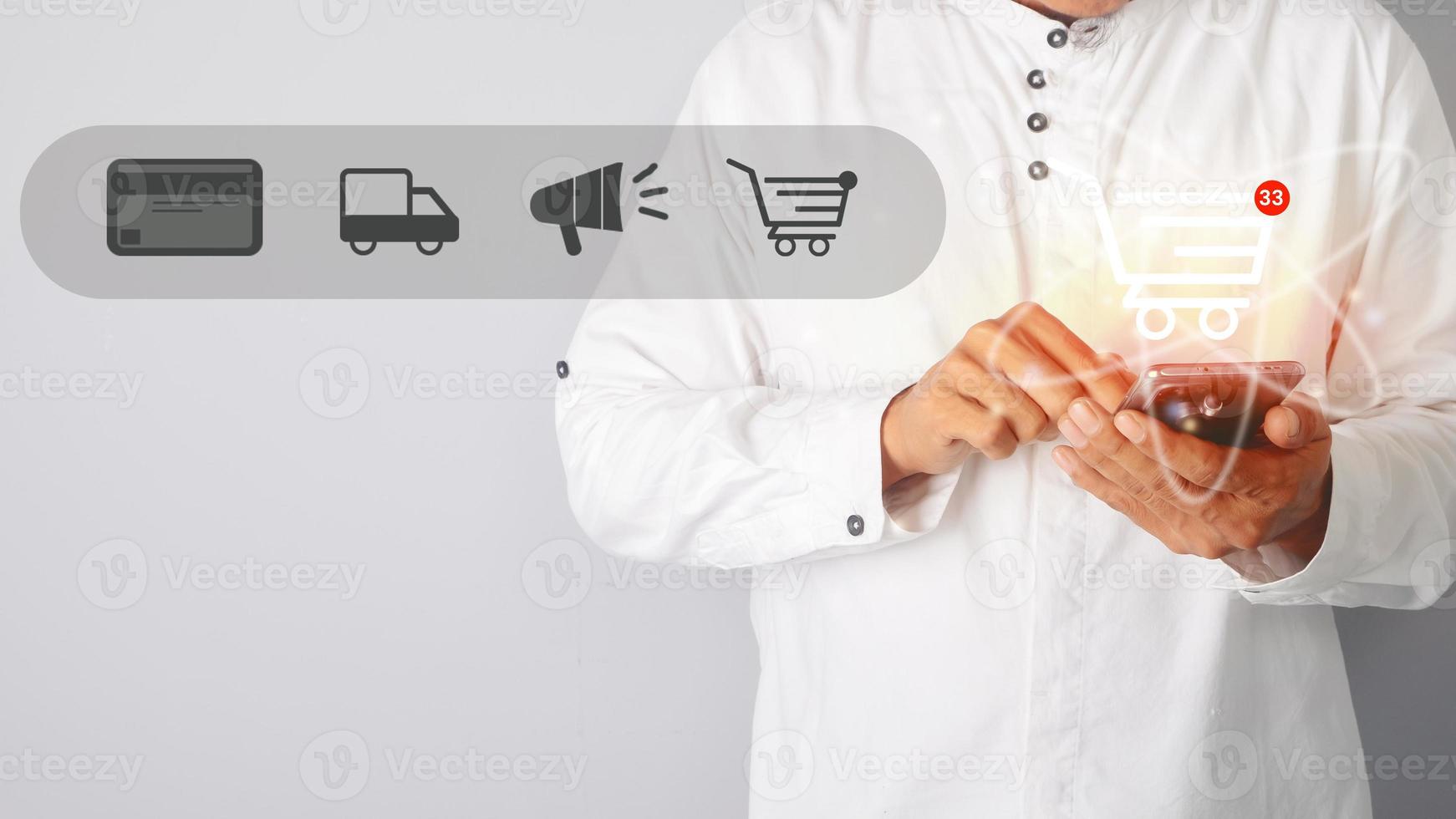 Hands holding shopping cart and business icons, online shopping, e-commerce business delivery, global internet shopping, services on worldwide online web. photo