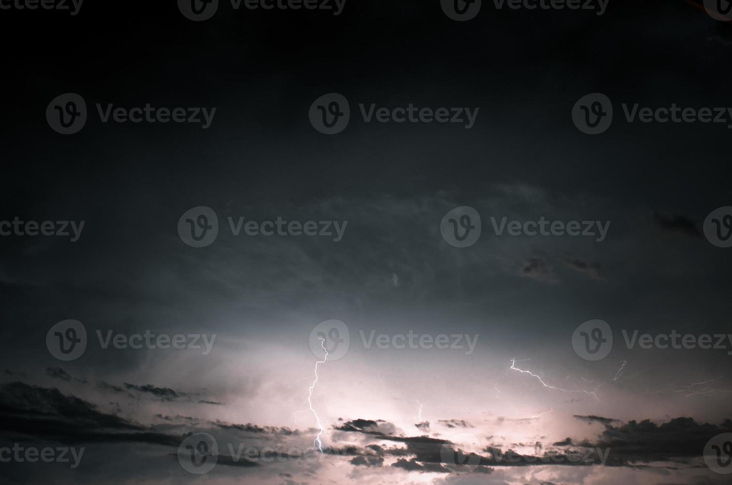 Lightning thunderstorm flash over the night sky. Concept on topic weather, cataclysms photo