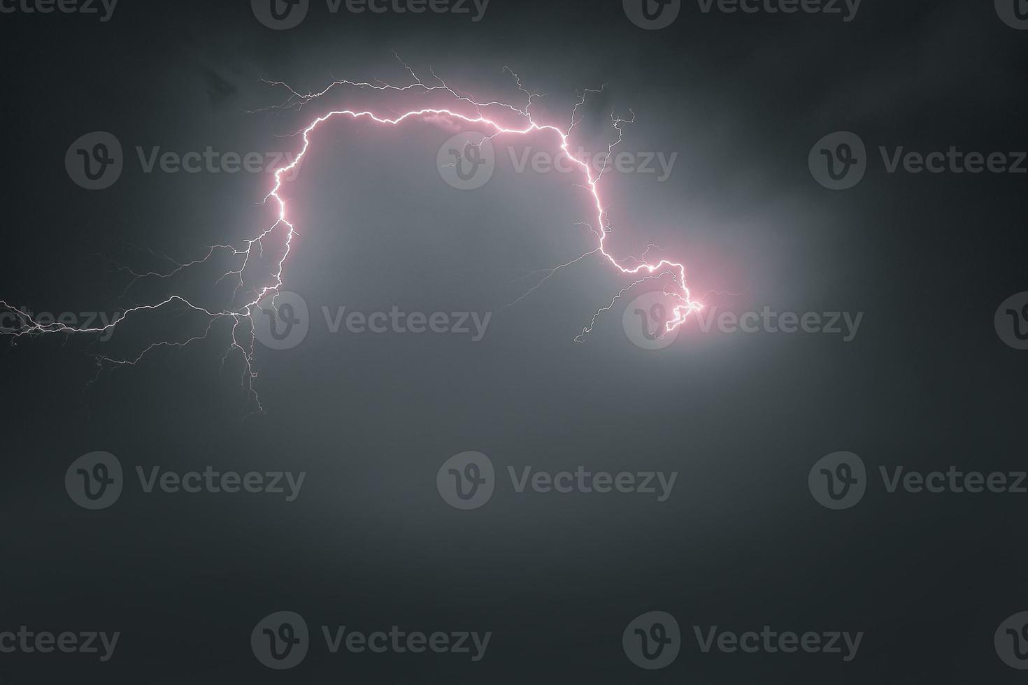 Lightning thunderstorm flash over the night sky. Concept on topic weather, cataclysms photo