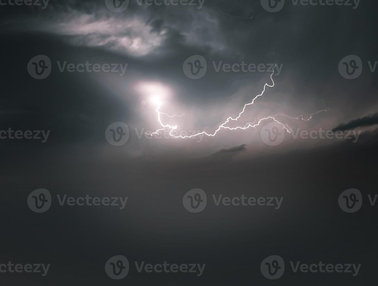 Lightning thunderstorm flash over the night sky. Concept on topic weather, cataclysms photo