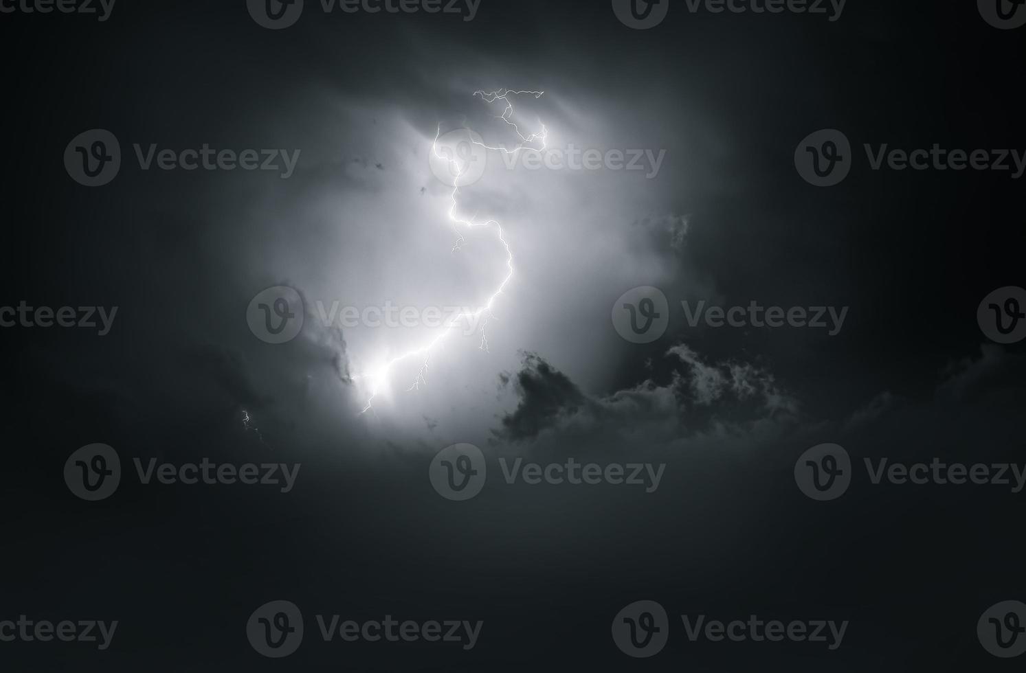 Lightning thunderstorm flash over the night sky. Concept on topic weather, cataclysms photo