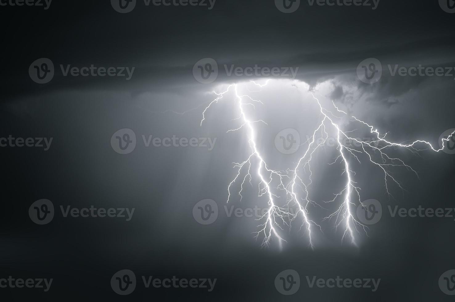 Lightning thunderstorm flash over the night sky. Concept on topic weather, cataclysms photo