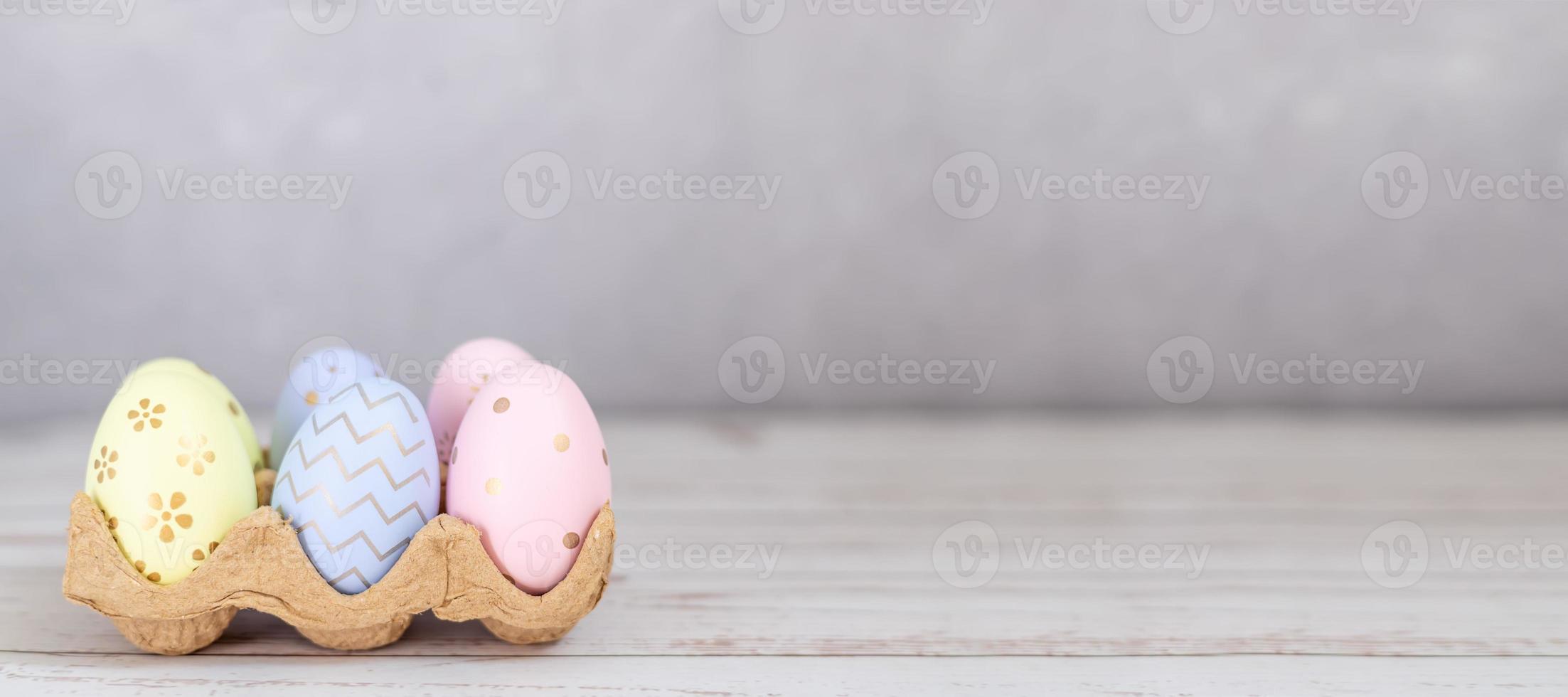 colorful Easter eggs on a grey background banner with space for text photo