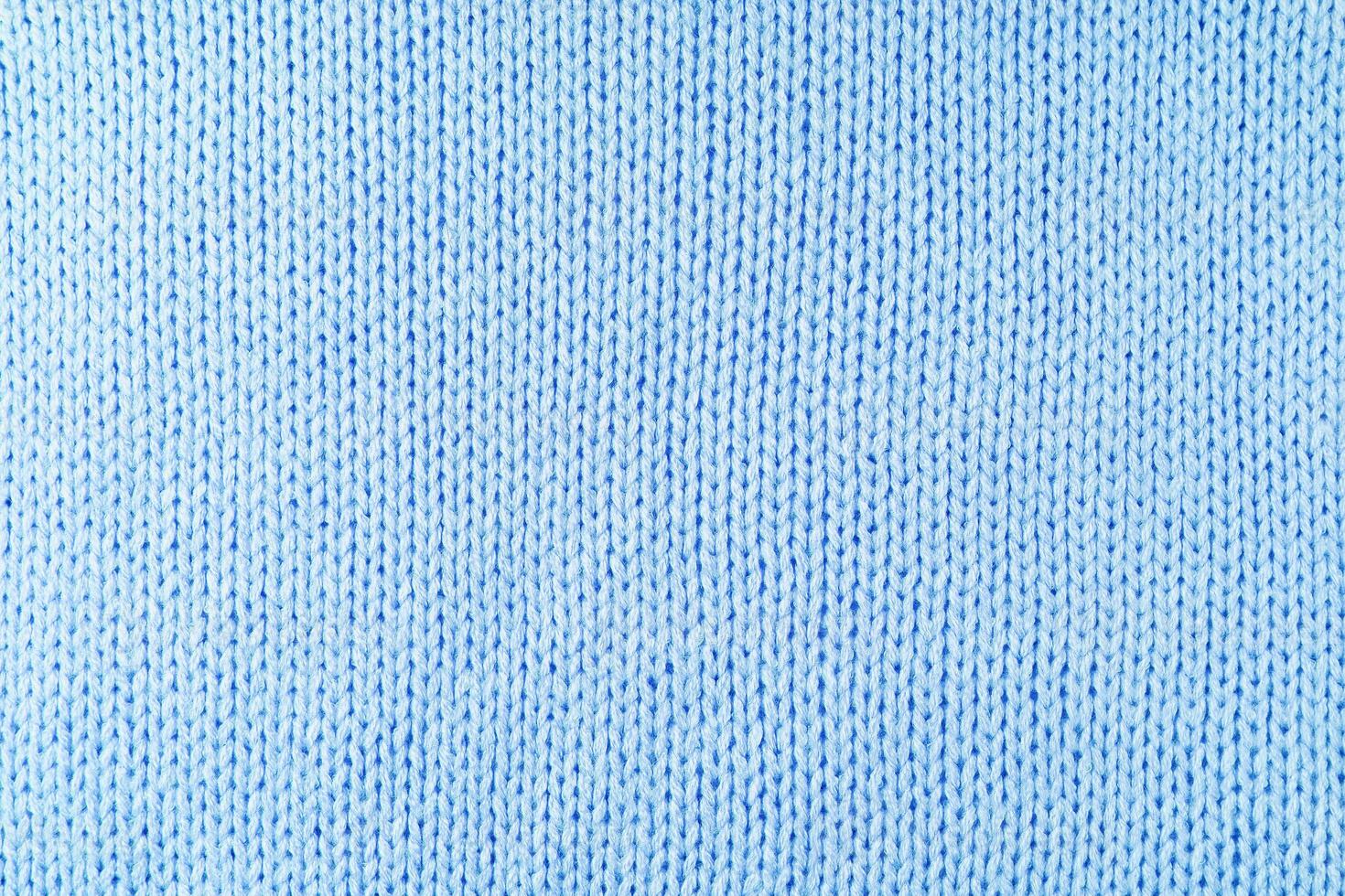 Fondo de textura de tela de lana de punto azul brillante. telón de fondo textil abstracto foto