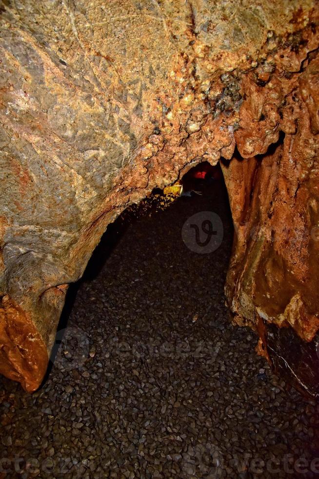 interesting original cave in the Turkish mountains with stalactites and stalagmites creating the background photo