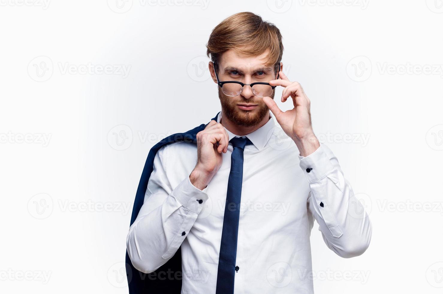 business man with a jacket over his shoulders wearing glasses self-confidence official photo