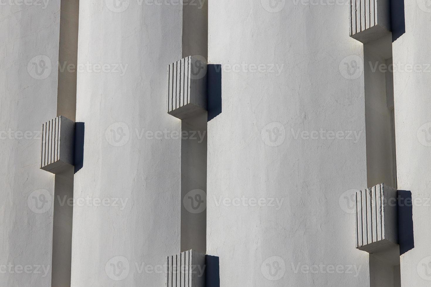 interesting original elements of the balconies in the white building photo