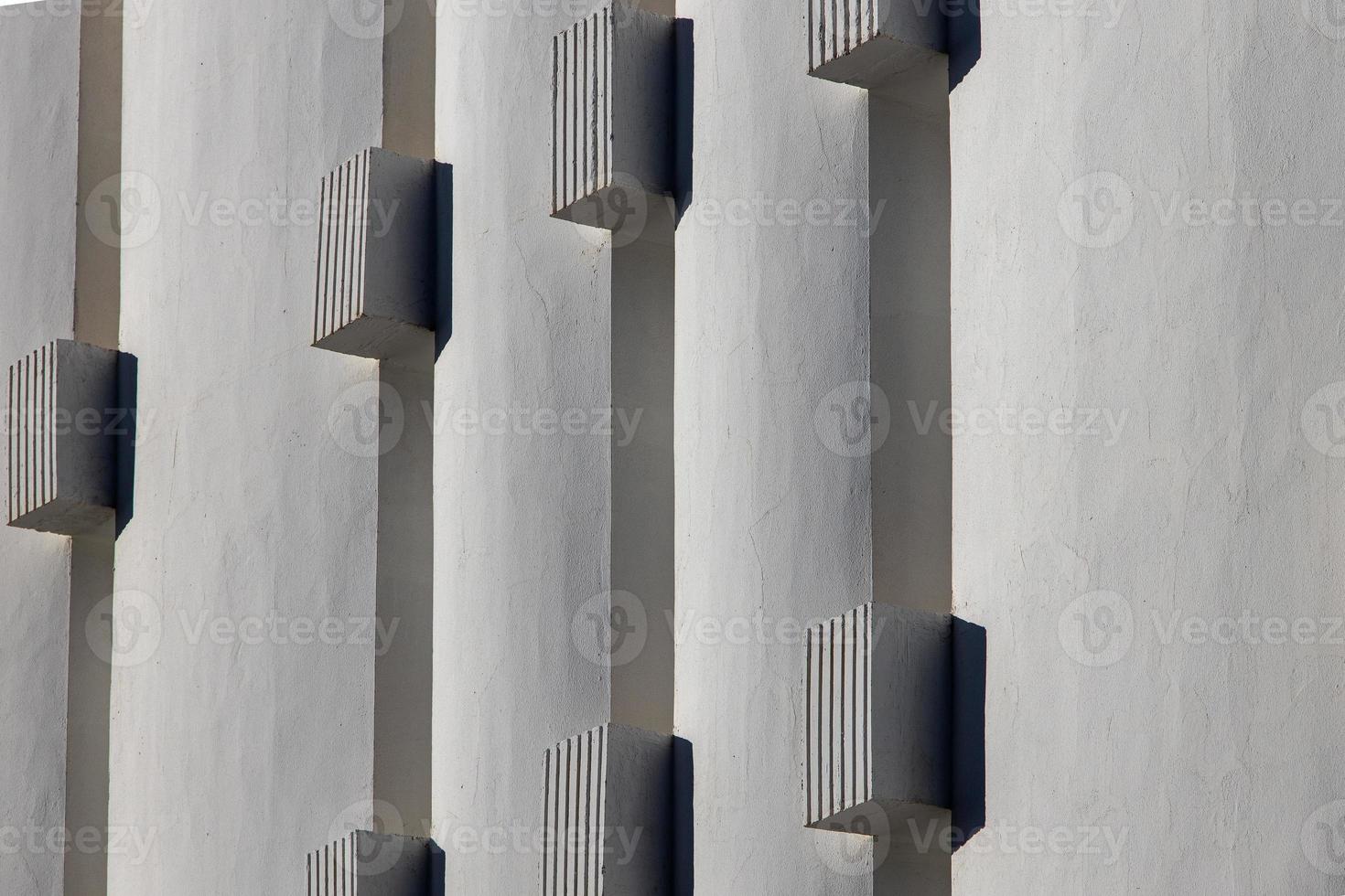 interesting original elements of the balconies in the white building photo