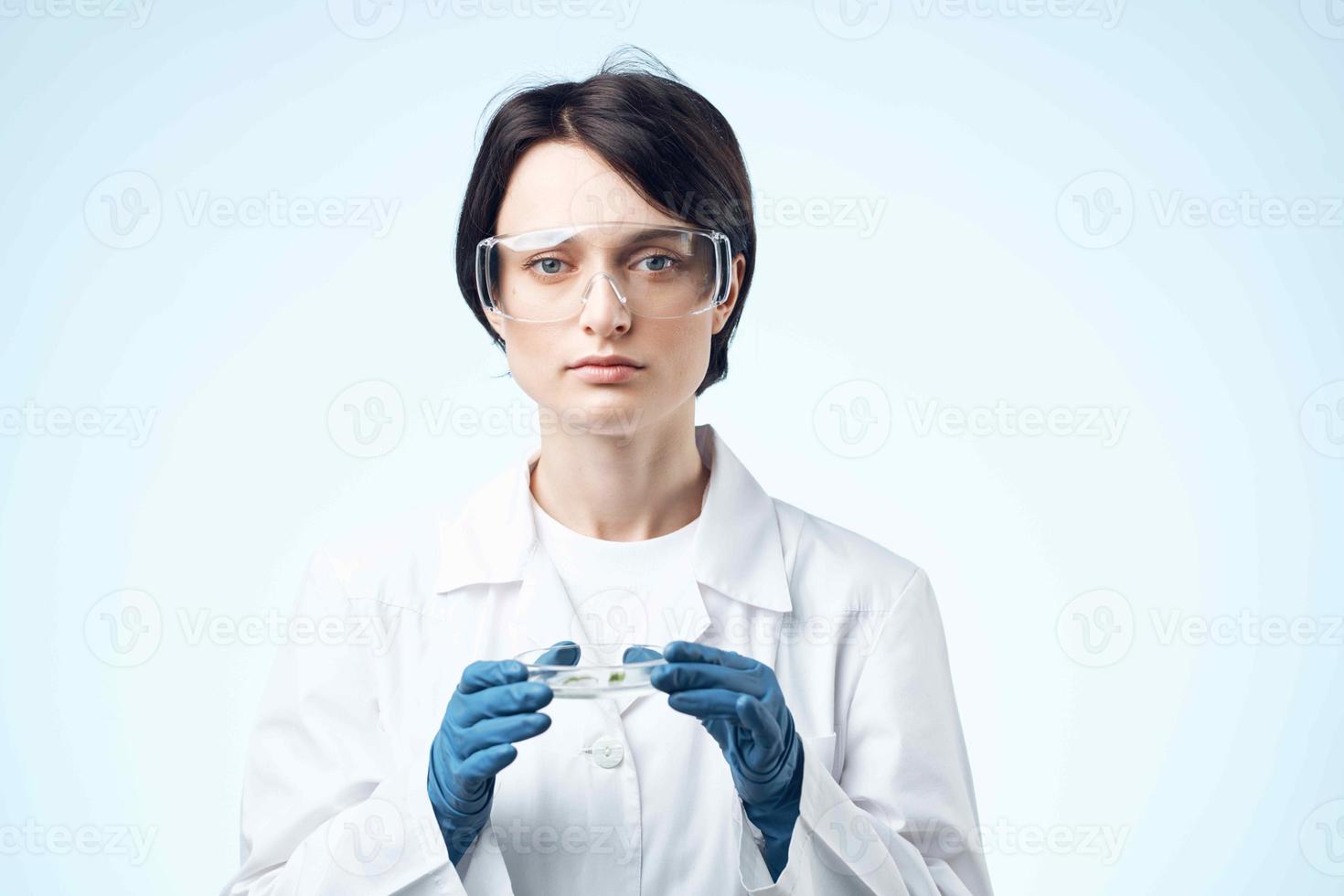 Woman in white coat biology laboratory research science photo