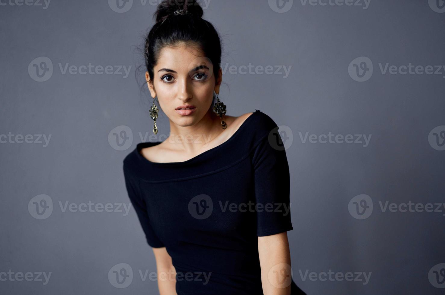 brunette earrings jewelry posing black dress lifestyle studio photo