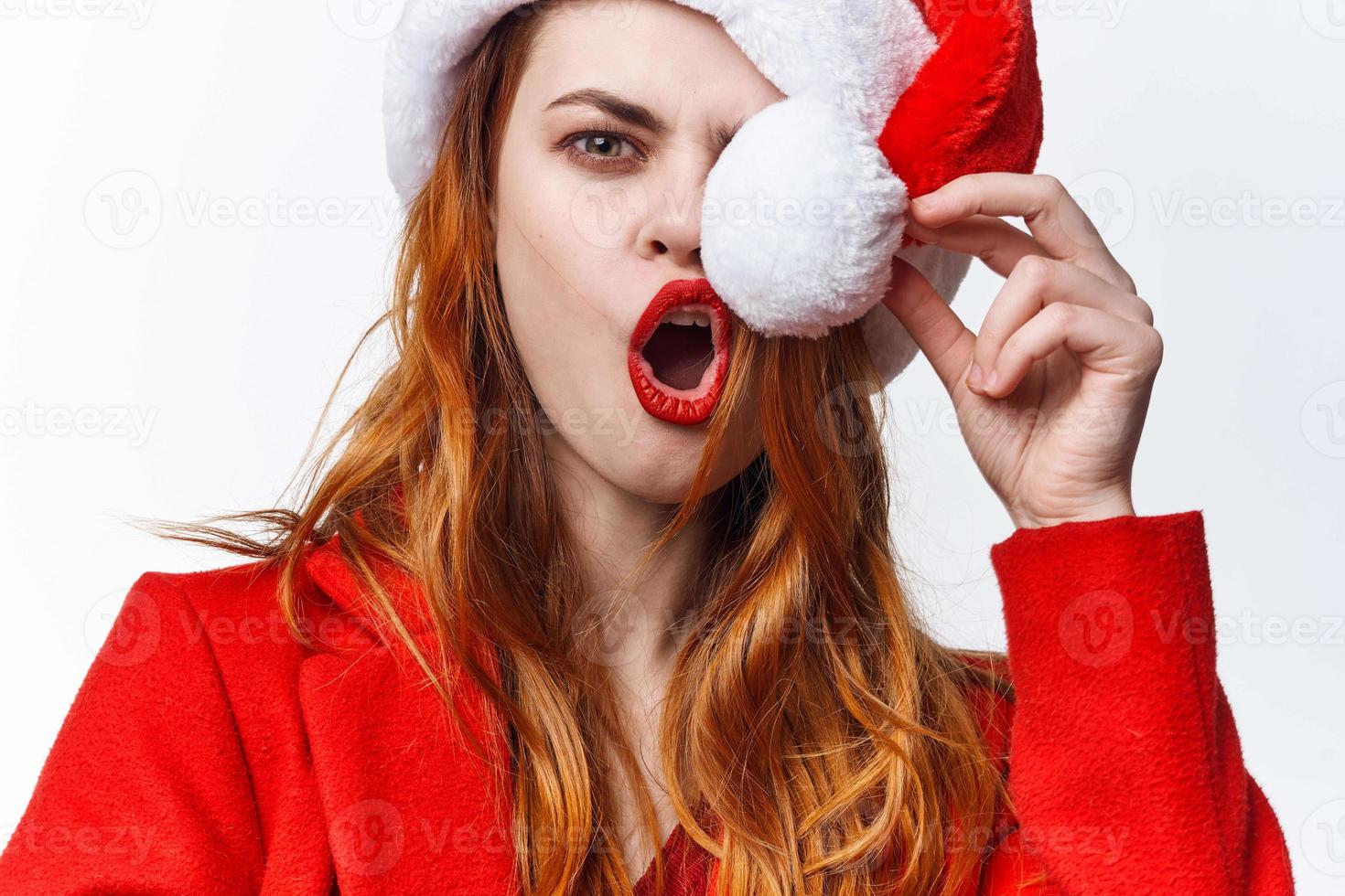 woman wearing santa hat emotions fun posing studio fashion photo
