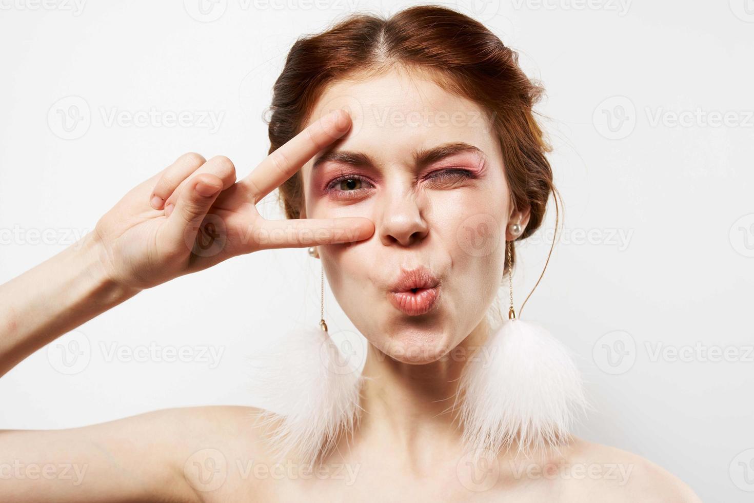 pretty woman with surprised facial expression naked shoulders cosmetics fashion photo
