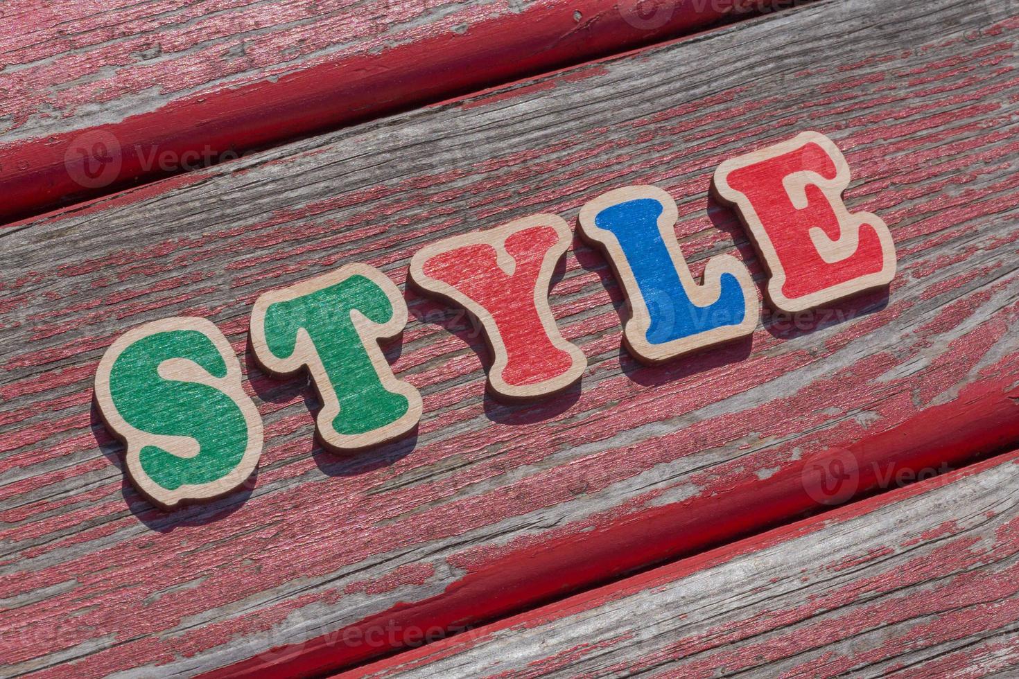 word style made of wooden letters on wood bench photo