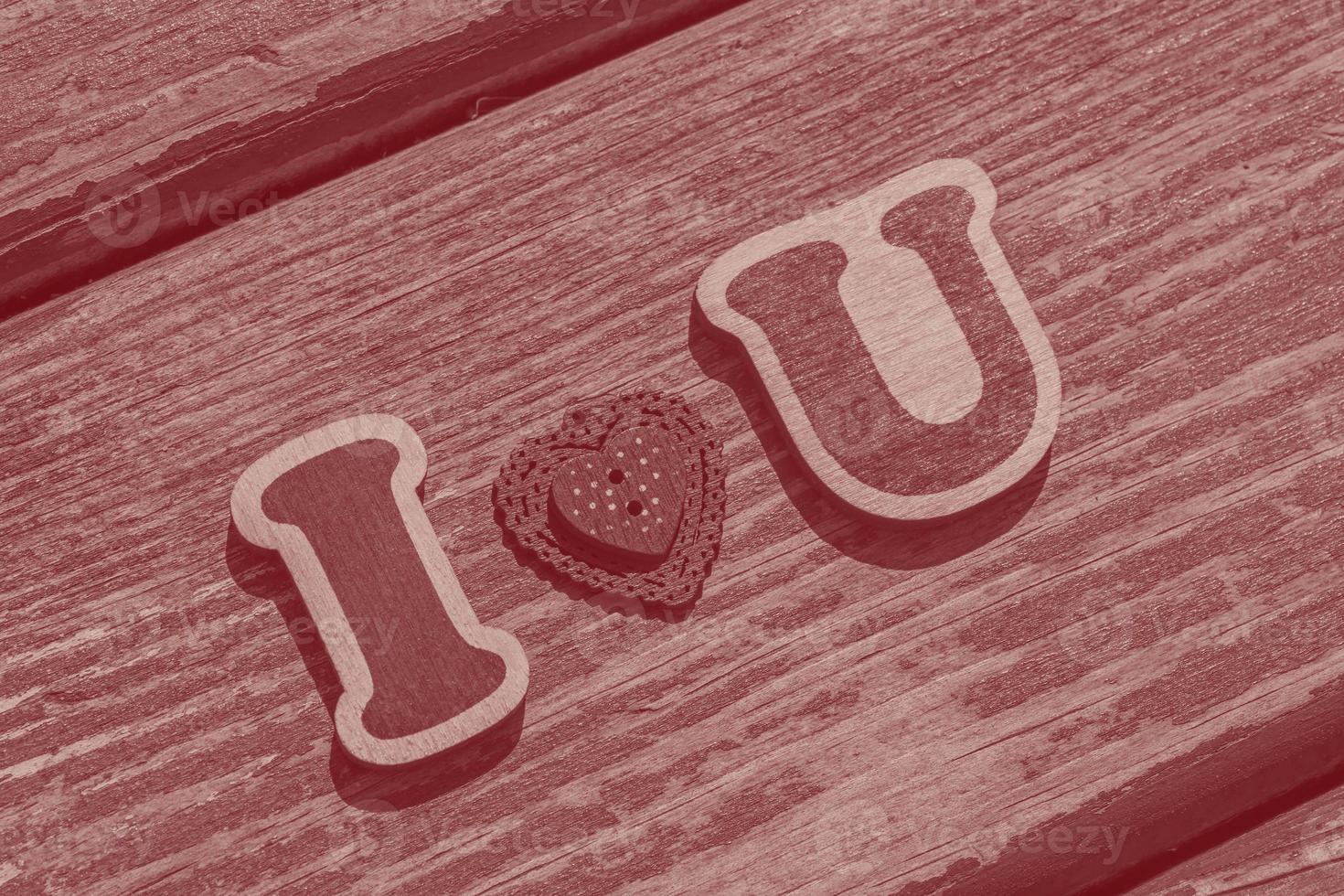 I love u message made of wooden letters and valentine button photo
