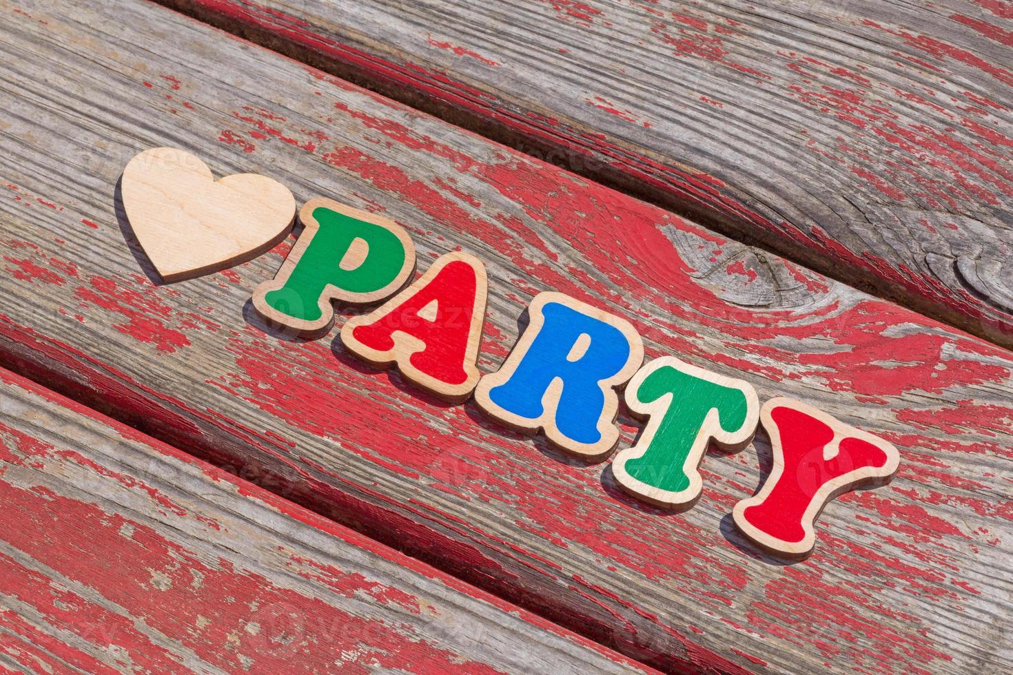 love party sign on aged wooden board photo