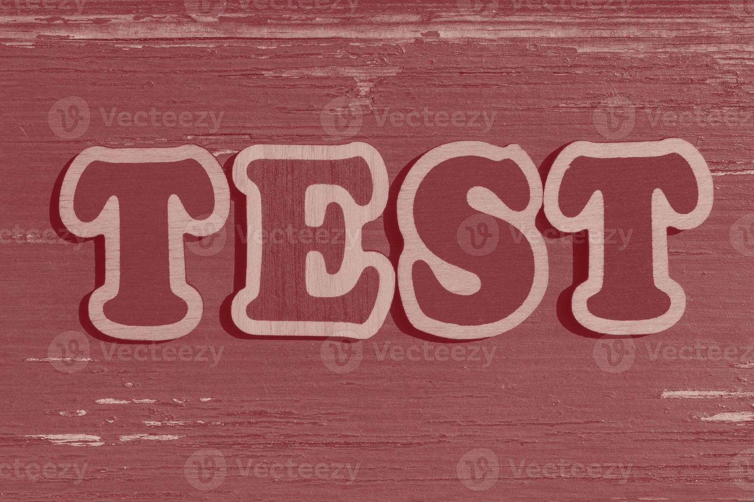 word test made of wooden letters on wood background photo