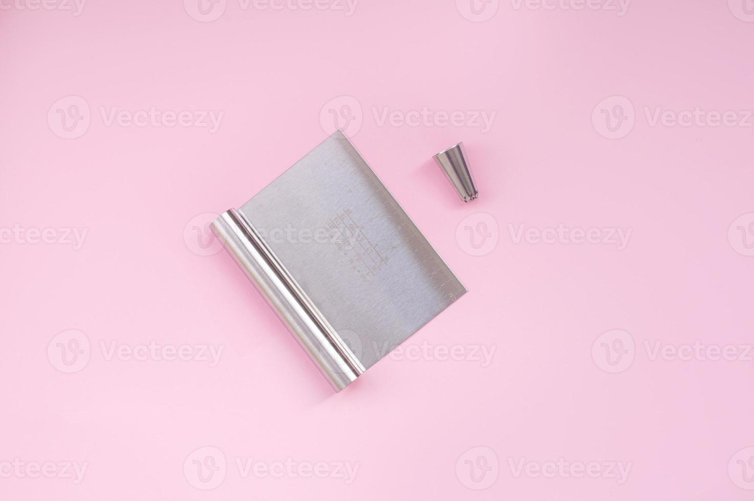 A professional set of spatulas for icing large cakes and a nozzle for cream. Confectioner's tools photo