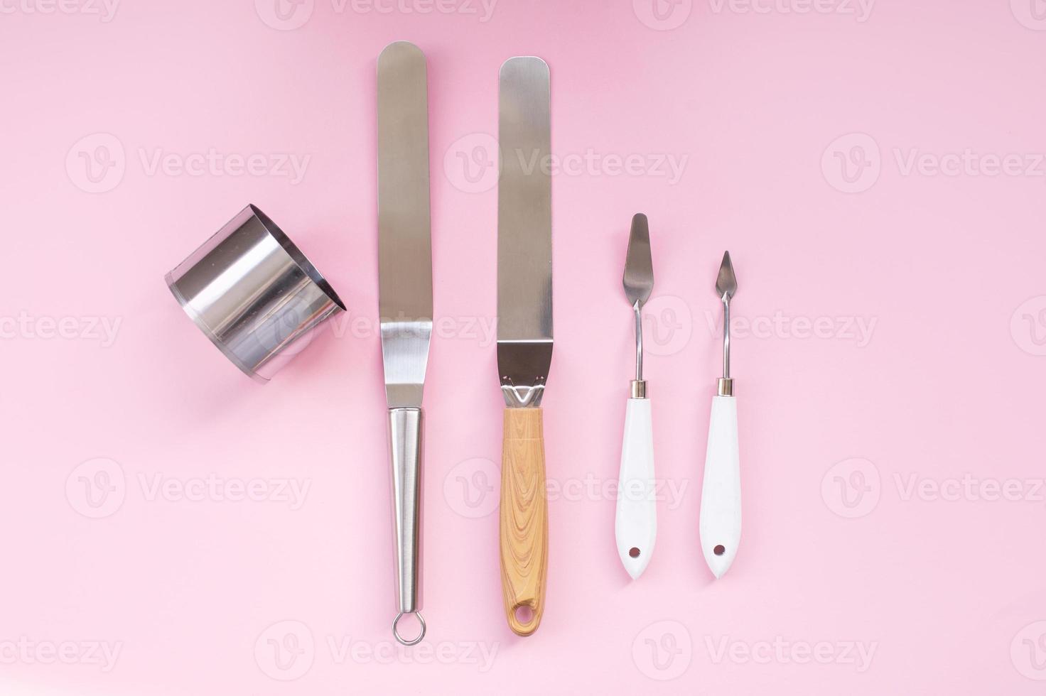 Professional spatula set for quick glazing of large cakes. Confectioner's tools, metal biscuit ring photo