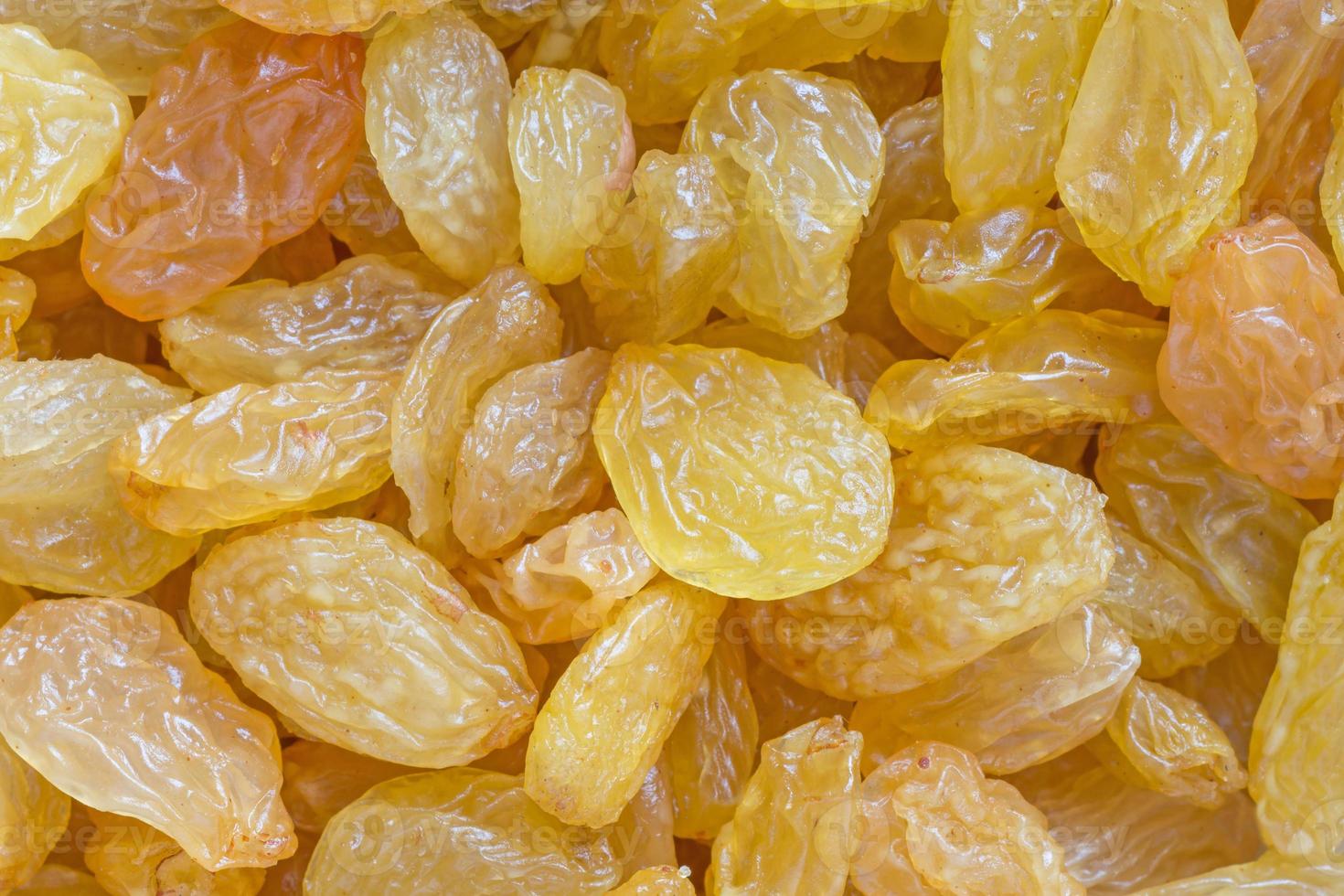 close up of heap of golden raisins photo