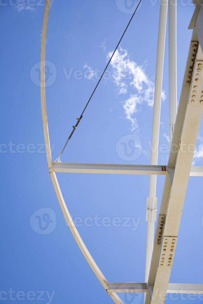 Detail of the structure of a steel structure against the blue sky. photo