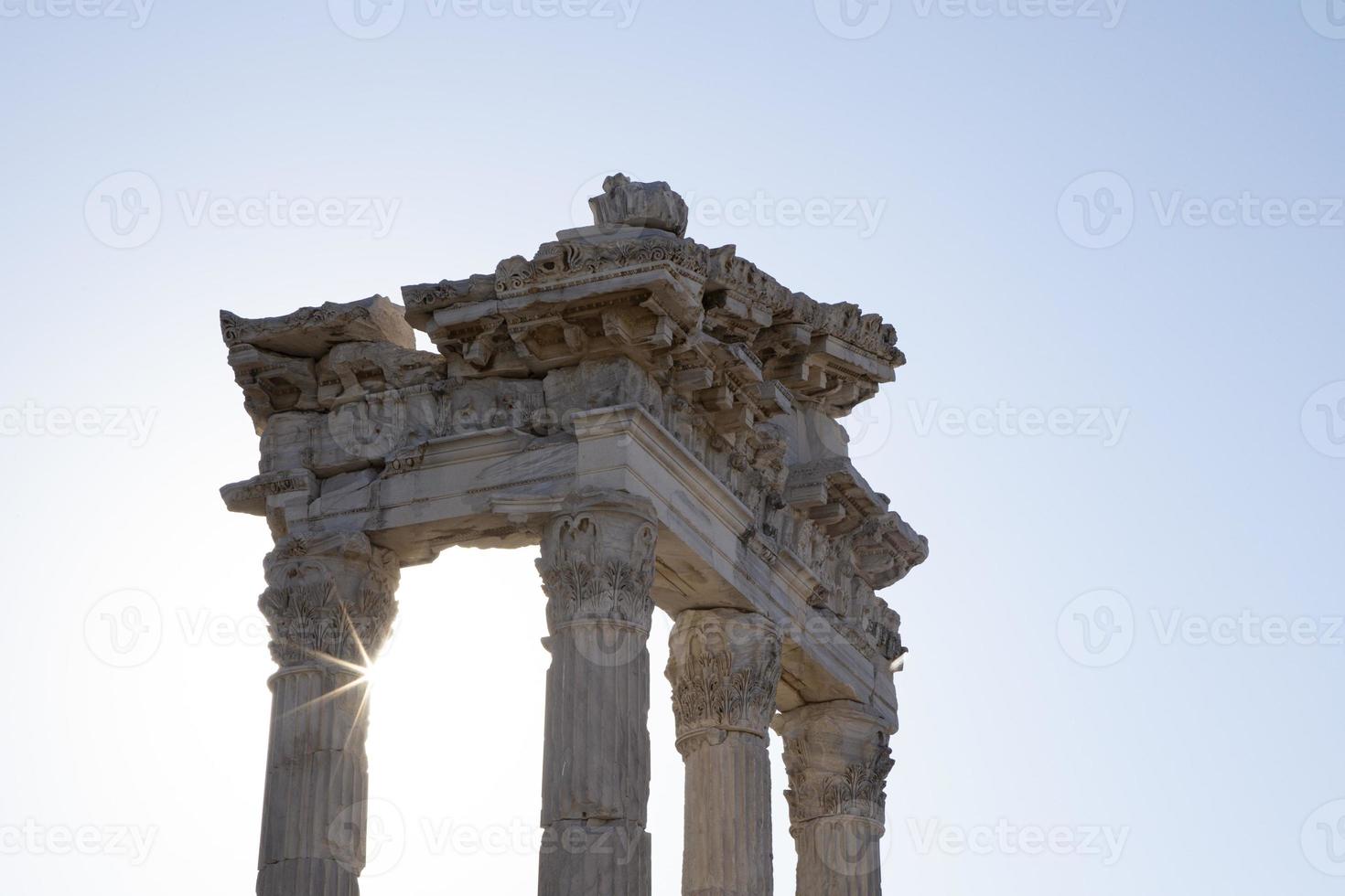 Ancient Ruins of Pergamon Acropolis. Ancient city column ruins with the sun in the background. Close-up. photo