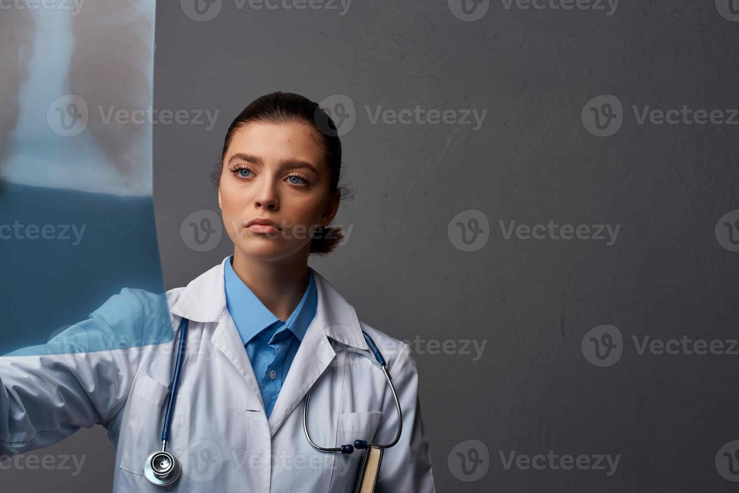 female doctor in white coat diagnostics x-ray hospital professional photo